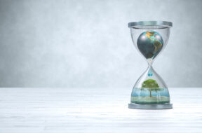 Earth planet in hourglass, Global warming concept.